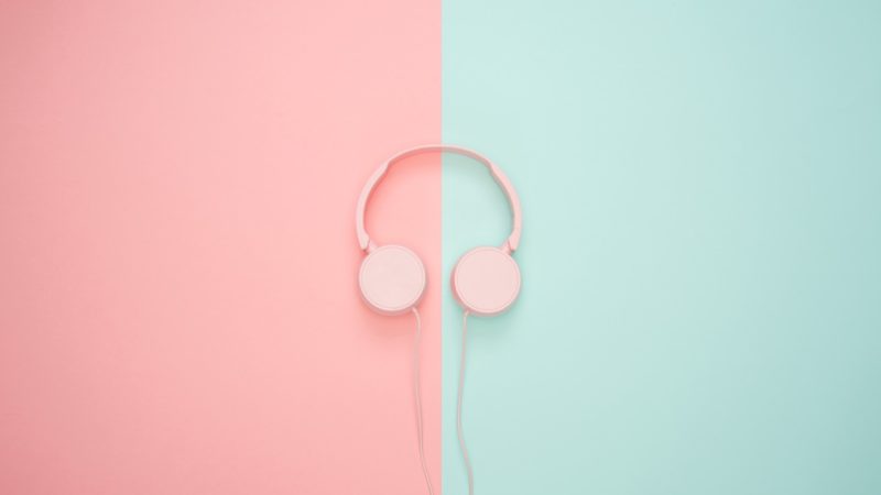 Headphone on pink and green background